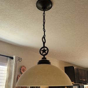 Texas star hanging light with antique finish